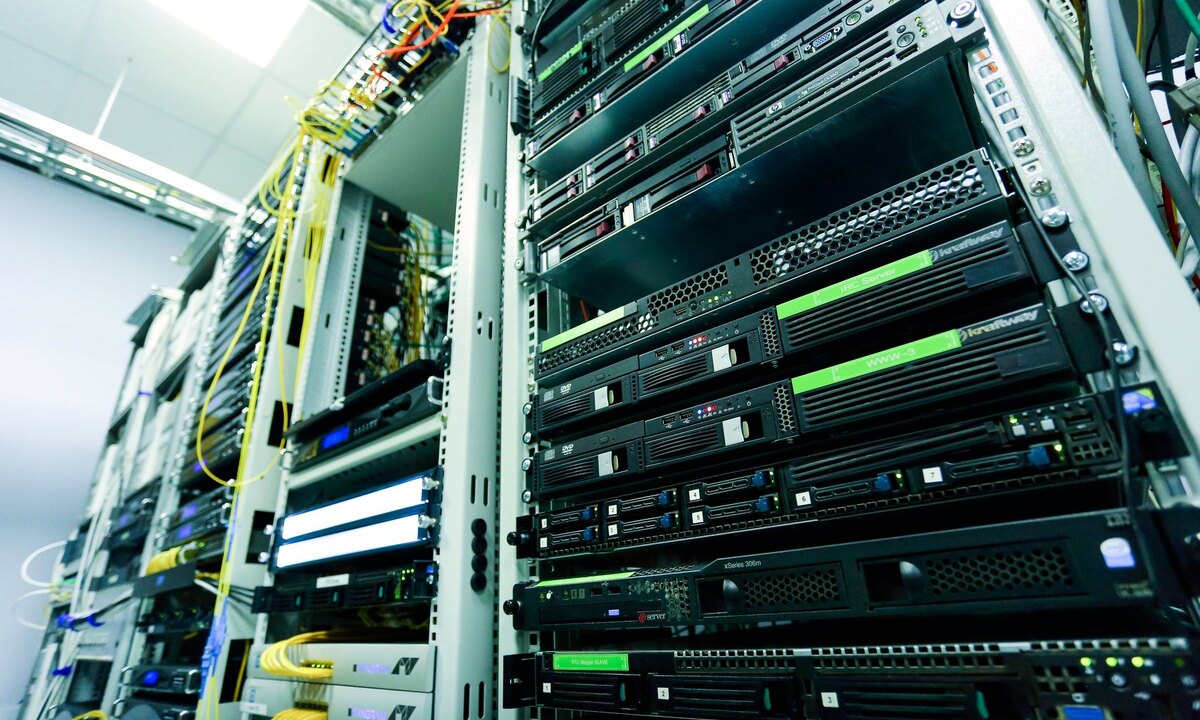 Server racks and network equipment inside a modern data centre